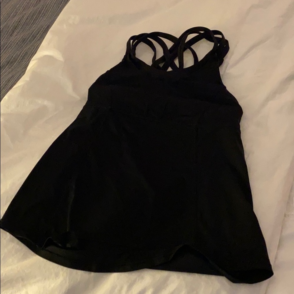 Used Black lululemon top size 4 with built in Bra